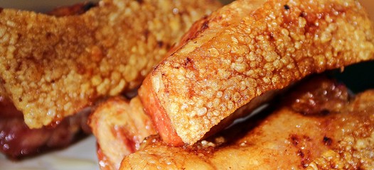 Golden brown fried crispy pork made from pig belly and skin
