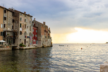 View of the typical croatian old houses in the coastline of the old town of Rovinj, Croatia, just on the Adriatic Sea, during the sunset