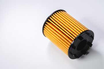 Paper plastic filtering element liner to filter oil new on gray gradient background