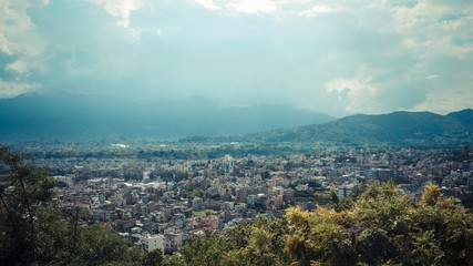City view with cloudy scenery of mountain