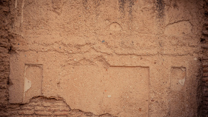 Close up image of a wall with damaged concrete