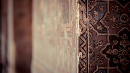 Concrete wall with carvings on the surface