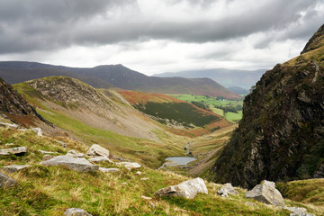Views from Little Dale towards the Dam at the end of Scope Beck with High Snab Bank and Blea Crags to the left in the Lake District.