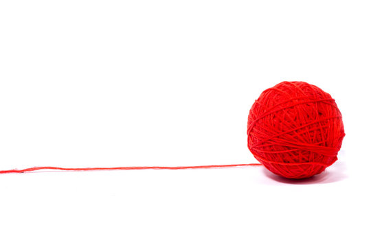 red ball of woolen thread,  Isolated on a white background.