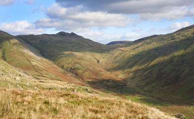 Fototapeta na wymiar Summit of Little Hart Crag, High Bakestones, Red Screes from below High Pike with Scandale Beck below in the Lake District.