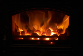 A closeup of smokeless fuel burning in a multifuel stove.