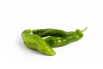 Italian green peppers on a white background