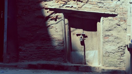 Old door made of metal with lock on