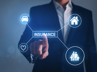 Hand businessman pointing Insurance inscription with  health, family, car, house icons.