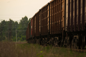 Fototapeta na wymiar Freight train on the railway in the evening