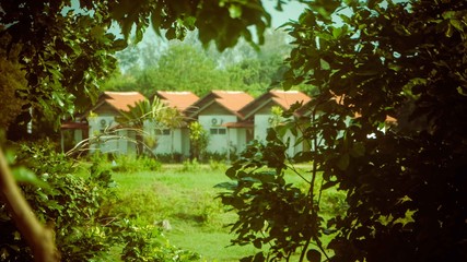 Rows of small concrete hut with red roof