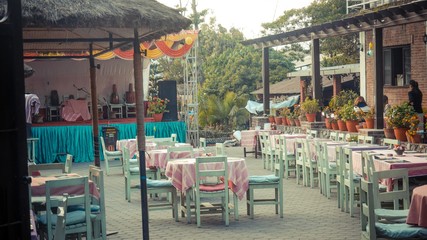 Sets of table and chairs with a stage