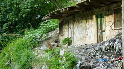 Small shack with graffiti on the wall