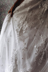 Bride's dress. Decoration on the dress. Wedding preparation.
