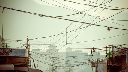 Telephone wires tangled up in the sky
