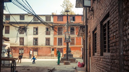 White and orange concrete wall with brick walls