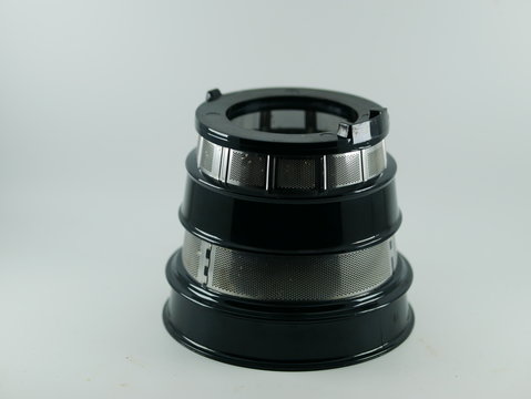 Strainer part of slow juicer. Strainer is equipped with an grid mesh that allows it to make clear juices.