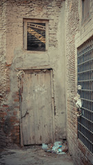 White brick wall with wooden white door