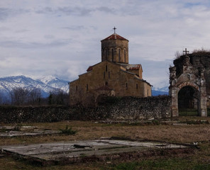Fototapeta na wymiar a very old Church in a sparsely populated place on a mountain in Abkhazia