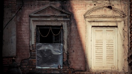White wooden doors with red brick wall