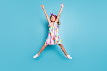 Fototapeta na wymiar Full length body size view of her she nice attractive lovely pretty glad cheerful cheery girl jumping enjoying holiday vacation having fun isolated on bright vivid shine vibrant blue color background