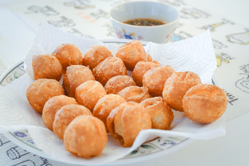 Thai Appetizer Batter Fried Fish Balls and Dipping Sauce.