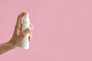 Caucasian woman's hand with antiseptic. Disinfection against virus bacteria health prevention. Alcohol spray. Health care