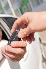 handing over the key to the car close-up