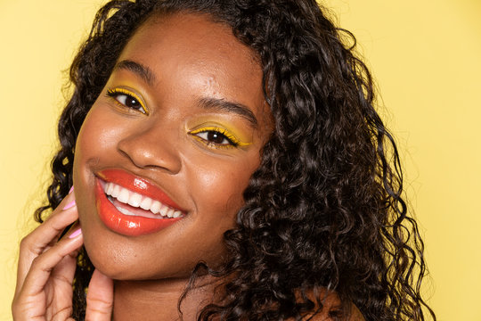 Happy Black Woman Wearing Yellow Eye Shadow