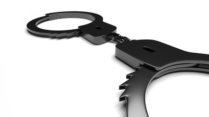 Real metal handcuffs. Closed police handcuffs close-up on a white background.