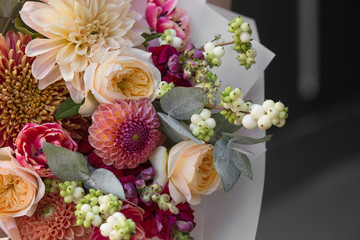 Spring bouquet of flowers with roses closeup. Peony rose, tulips, dahlia, aster. Flower shop. Spring. Flower Background. Wallpaper. Woman's day.