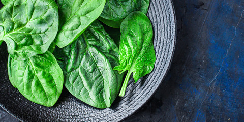 spinach fresh green petals Menu concept healthy eating. food background top view copy space for text healthy eating table setting keto or paleo diet organic