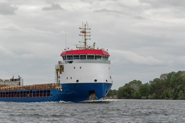 Naklejka premium MARITIME TRANSPORT - The merchant ship sails on a cruise 
