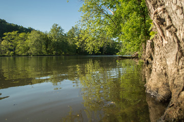 Gentle ripples on a flat water river.
