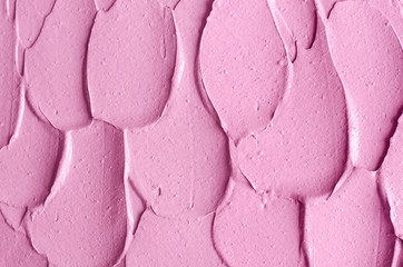 Pale pink cosmetic clay (alginate facial mask, face cream, body wrap) texture close up, selective...