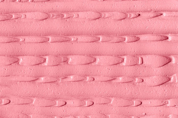 Pale pink cosmetic clay (rhassoul, alginate facial mask, face cream, body wrap, hair shampoo) texture close up, selective focus. Abstract background with brush strokes.