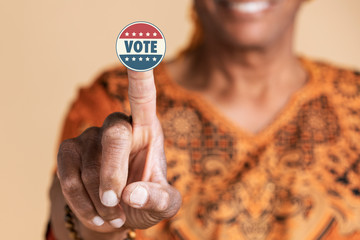 Indian man showing a vote sticker