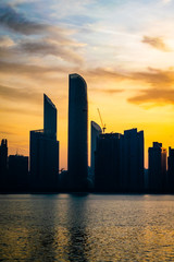 Obraz na płótnie Canvas a beautiful sunrise view of Abu Dhabi City from Marina Breakwater Abu Dhabi, UAE, morning, Abu Dhabi sunrise, golden hour