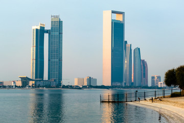Fototapeta na wymiar a beautiful sunrise view of Abu Dhabi City from Marina Breakwater Abu Dhabi, UAE, morning, Abu Dhabi sunrise, golden hour