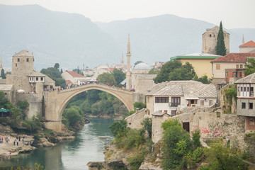 Fototapeta na wymiar Stari Most, also known as Mostar Bridge, is a rebuilt 16th-century Ottoman bridge in the city of Mostar in Bosnia and Herzegovina that crosses the river Neretva and connects the two parts of the city