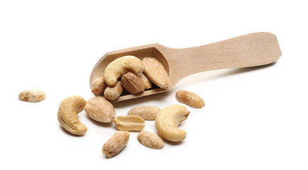 Marinated peanuts, almonds and cashews, nuts snack mix with wooden spoon isolated on white background