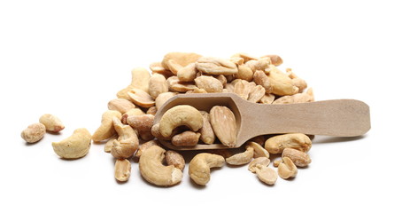 Marinated peanuts, almonds and cashews, nuts snack mix with wooden spoon isolated on white background