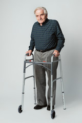 Senior man using a zimmer frame