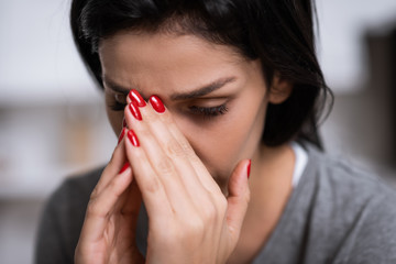 close up of upset woman with bruise covering face, domestic violence concept