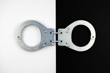Handcuffs on a black white background