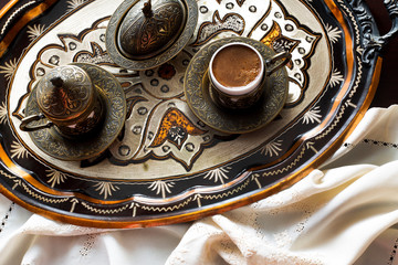 Turkish coffee with delight and traditional copper serving set. Feast of Ramadan.