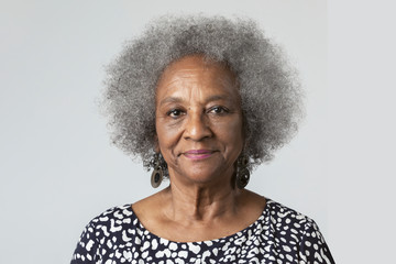 Happy black senior woman in a studio shoot - Powered by Adobe