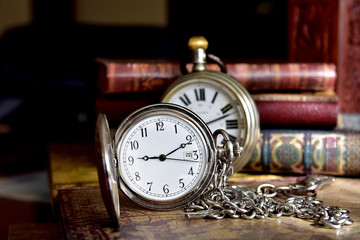 old pocket watch and book