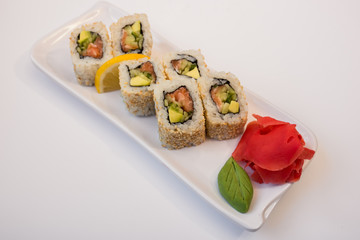  sushi in a plate on a white background