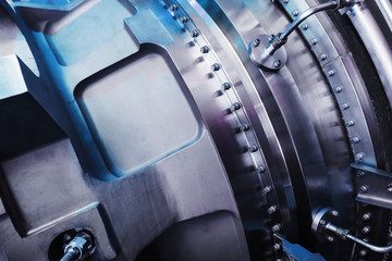 A detailed view of the gas turbine engine for generating electricity, shows the bolt connection...